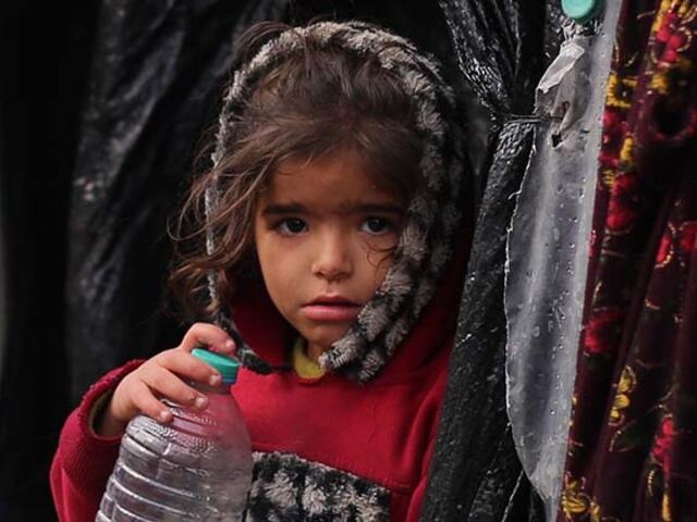 Young girl holding a water bottle