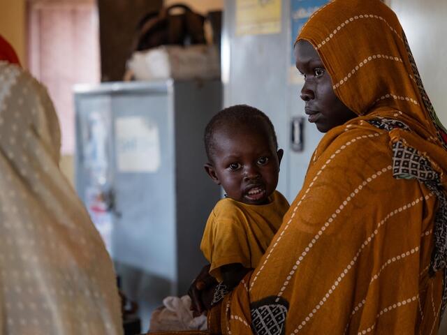 A mother with a child receiving nutrition services at a UNICEF-supported clinic in Khartoum state, Sudan.