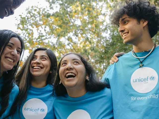 UNICEF USA youth council members standing in a circle and laughing