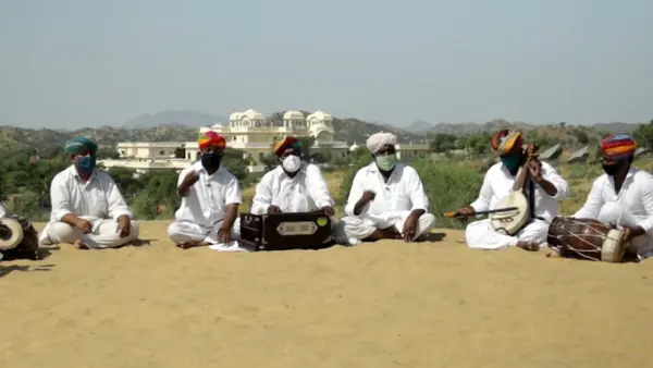 Folk musicians in Rajasthan, India, sing a traditional song rewritten to convey key messages about defeating COVID-19 with the vaccine.