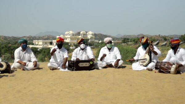 Folk musicians in Rajasthan, India, sing a traditional song rewritten to convey key messages about defeating COVID-19 with the vaccine.