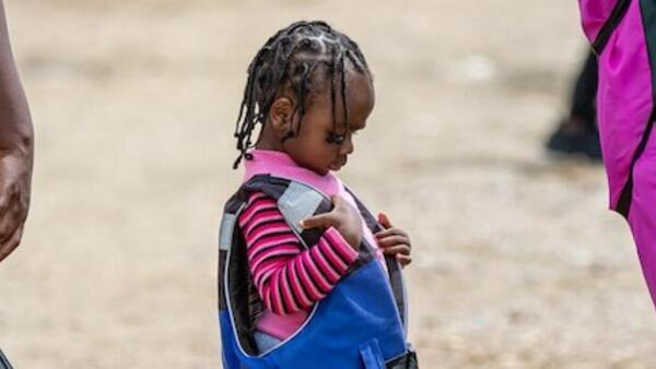 A child migrant from Haiti on the move.