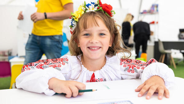 On Sept. 1, 2022, in Lviv, Ukraine, a girl draws at a Spilno center set up by UNICEF and partners to provide a welcoming place where children affected by the war can make friends, play, learn and connect with support services. 