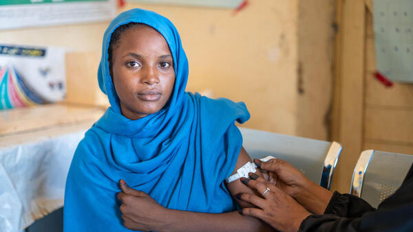 Hosnia Abdul, a pregnant and lactating mother with a 1-year-old son, is screened for malnutrition during an antenatal care visit at UNICEF-supported village health center in North Delta, Kassala state, Sudan.