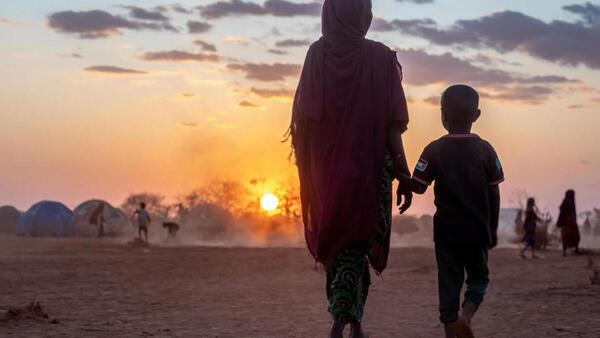 In Somali region of Ethiopia, near the town of Hargele, a mother and her son displaced by drought walk near the camp where they are staying.
