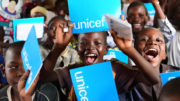 Children are happy they received new notebooks from UNICEF, in Ndjamena, the capital of Chad.