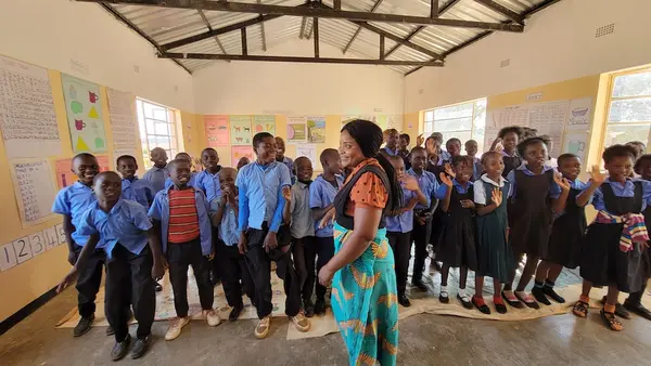 A teacher and her students at the Bimbe School in Chongwe district, Lusaka province, Zambia, where UNICEF and partners support an accelerated learning program to help students catch up.