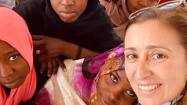 Sara Bordas Eddy, Chief of Humanitarian Field Support, UNICEF Office of Emergency Programs, with children in Sudan.