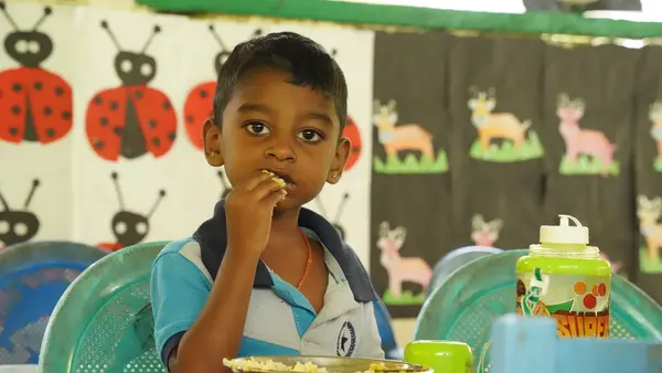 Four-year-old Sageeth eats rice and fruit during mealtime at Little Star Preschool in Deraniyagala, in rural Sri Lanka, one of 725 schools supported by UNICEF. 