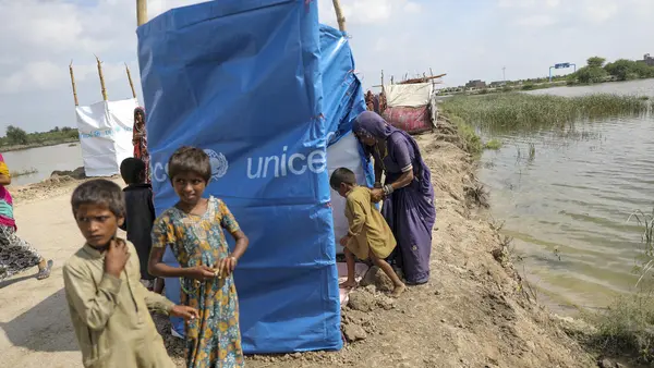 A family left homeless by the Pakistan floods take shelter by the side of the road in Mirpur Khas district, Sindh province, Pakistan.