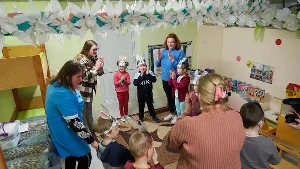 Kindergarten teachers conduct lessons with children in a basement bomb shelter renovated by UNICEF in Slavutych, Ukraine. 
