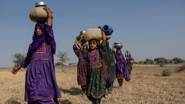 Young girls fetching water near a contaminated pond in Allah Abad, Jampur, South Punjab, Pakistan. 