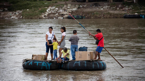 In Ciudad Hidalgo, Chiapas, Mexico, a makeshift raft is used to informally move people and products across the Suchiate River between Ciudad Hidalgo, Chiapas, Mexico and Ciudad Tecún Umán, Guatemala, on Oct. 12, 2022