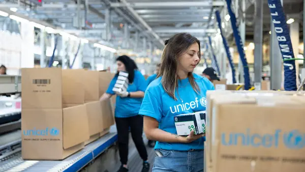 At the UNICEF Global Supply and Logistics Hub in Copenhagen, staff pack medical, nutrition and shelter supplies for delivery to children and families affected by devastating floods in northeastern Libya. 