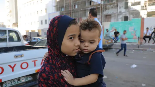 On Oct. 17, 2023, children evacuate their home in northern Gaza, seeking refuge in the southern region..
