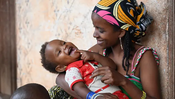 In Bertoua, eastern Cameroon, 23-year-old Houreratou Abdoulay cuddles her youngest child Awaou.