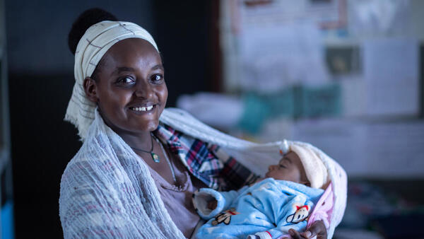 Kokobe Ashebir, 20, brings her 2-month-old baby for a routine check-up at Kolabe Bale Health Post in Sire, Oromia Region, Ethiopia. 