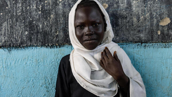 A student celebrates her graduation day at Taffari Community School in the Taffari IDP camp, South Kordofan, Sudan.