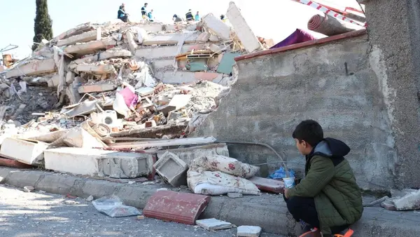 Berat, 9, waits for his friend to be rescued from the rubble after an earthquake rocked Kahramanmaraş, Türkiye.. 