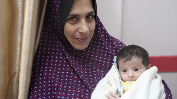 On Jan. 16, 2024, Qazala holds her 1-month-old son, Khaled, who was born here at Nasser hospital in Khan Younis, the largest remaining functioning medical center in the Gaza Strip. 