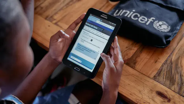A high school student uses a tablet to access online courses at the Mahajanga’s Public General Education College Charles Renel in the Boeny Region of Madagascar. 