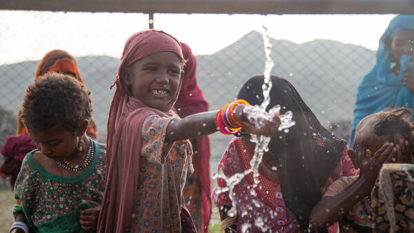 Children collect clean and safe water from a new water station in the small village of Gelhanty in Agig locality, Red Sea state, Sudan.