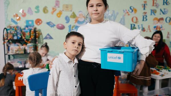 Siblings Eva, 10, and Misha, 6, refugees from Odesa, Ukraine, attend a UNICEF play and learning hub in Balti, Moldova.