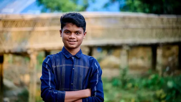 Anayet, 15, an adolescent peer leader, stands outside a UNICEF-supported multi-purpose center in the Rohingya refugee camps in Cox’s Bazar, Bangladesh, on Nov. 7, 2023.
