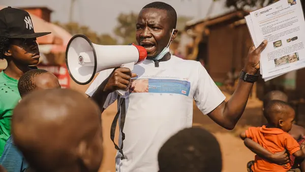 Innocent Murula, a UNICEF-supported community outreach worker, uses his megaphone to raise community awareness about mpox in Kamanyola, South Kivu province, Democratic Republic of the Congo, on July 25, 2024.