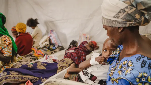 A mother holds her child suffering from mpox at the mpox isolation unit of the UNICEF-supported Kavumu Hospital in South Kivu province, Democratic Republic of the Congo (DRC), on July 23, 2024
