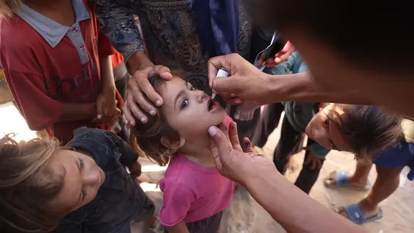 Children receive polio vaccines at a health clinic in Khan Younis, southern Gaza Strip, in September 2024. 