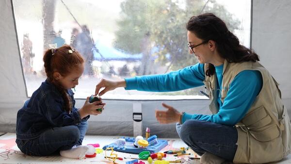 Heghine Ghukasyan, UNICEF Focal Point in Syunik, plays with Viktoria, a child displaced from Karabakh, in a child corner, part of a child-friendly space established by UNICEF Armenia in Goris.