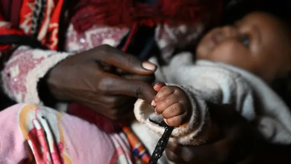 An 18-year-old mother, who was raped by a man who later disappeared, with her 4-month-old daughter at a UNICEF-supported IDP site in in the Borena zone, Oromia region, southern Ethiopia.