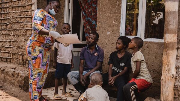 Mwamini Badesire, a community leader and UNICEF-supported community outreach worker, raises awareness about mpox symptoms and prevention measures with the Amani family in Chireja village, South Kivu province, DR Congo, on Sept. 13, 2024.