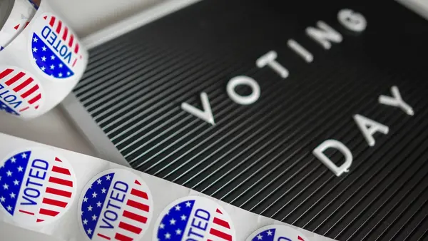 'I Voted' stickers and a sign that reads Voting Day.