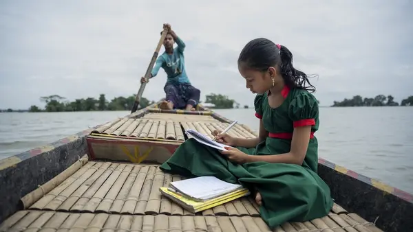 Flooding interrupted schooling for Tawhida, 10, of Manikpur, Shantiganj, Bangladesh, who attends a UNICEF-supported learning center, traveling to and from the school by boat.