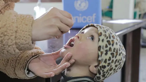 A child receives the oral polio vaccine at Sabra health clinic in Gaza City on Feb. 22, 2025.