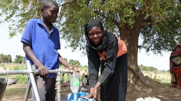 In June 2023, Mariam, a Sudanese refugee from the town of Tendelti, collects water from a borehole installed by UNICEF in the village of Koufroun, eastern Chad. 