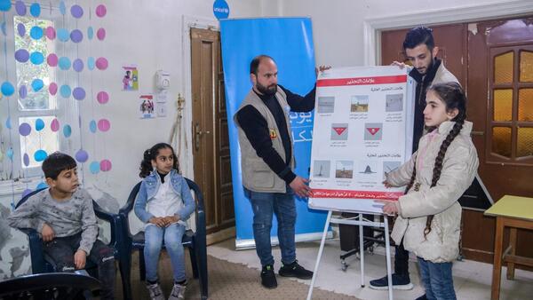 Children attend an awareness session about the risk of explosive ordnance at a UNICEF-supported child-friendly space in Deir-ez-Zor city, northeast Syria, on Feb. 6, 2024.