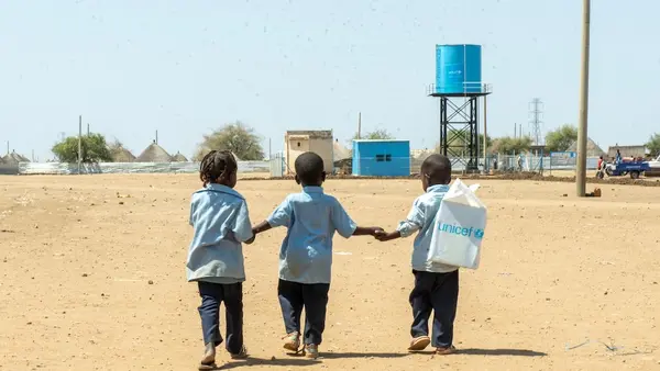 On March 2, 2025, children walk back home from a UNICEF-supported child-friendly space in Al Houri internally displaced people’s (IDP) camp in Gedaref State, Sudan.