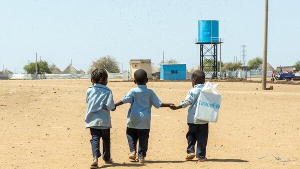On March 2, 2025, children walk back home from a UNICEF-supported child-friendly space in Al Houri internally displaced people’s (IDP) camp in Gedaref State, Sudan.