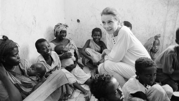 UNICEF Goodwill Ambassador Audrey Hepburn meets mothers and children greets children and women at a feeding center in Mogadiscio, Somalia in 1992.  