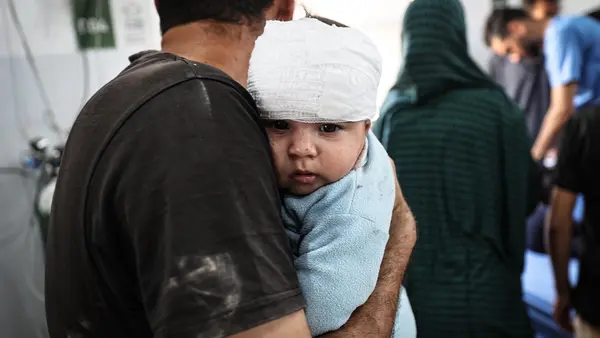 On May 22, 2025, Fares Nassar, 8 months old, receives treatment at Al-Awda Hospital in Nuseirat camp after an airstrike targeted the Al-Hasayneh School, housing displaced Palestinians.