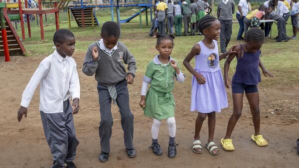 Young children play at a UNICEF-supported safe park in South Africa