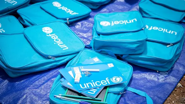 At a UNICEF warehouse, UNICEF school kits are prepared for delivery to children.. 