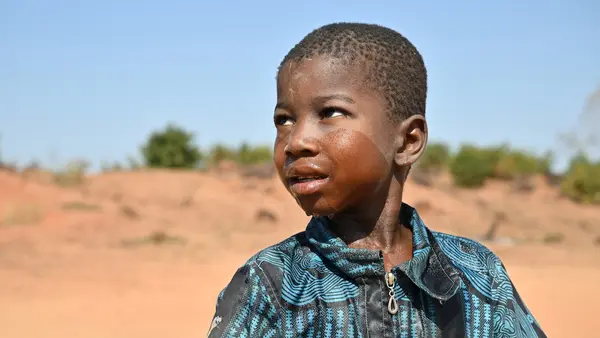 A boy receiving support at a UNICEF child-friendly space in Fada N’gourma, eastern Burkina Faso.