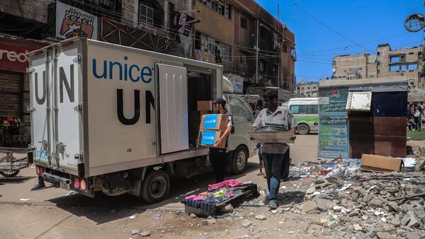 Boxes of diapers are unloaded from a UNICEF truck for delivery to the neonatal intensive care unit of the Friends of the Patient Society Hospital in Gaza City on July 30, 2025.