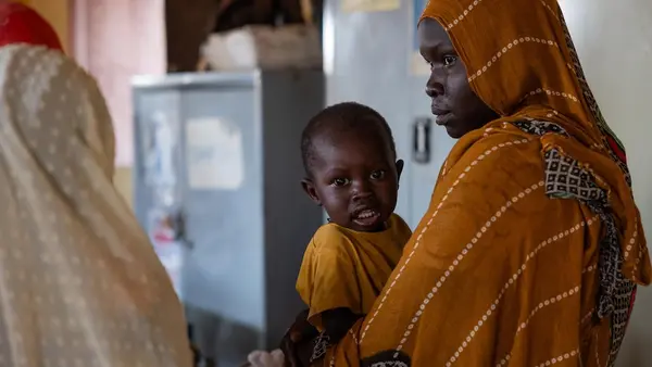 A mother with a child receiving nutrition services at a UNICEF-supported clinic in Khartoum state, Sudan.
