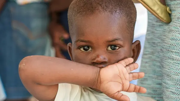 A child waits his turn at a UNICEF-supported mobile health clinic in Boucan Carré, Haiti.