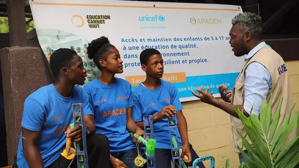 Young people in Haiti attend a UNICEF-supported job skills training program. 